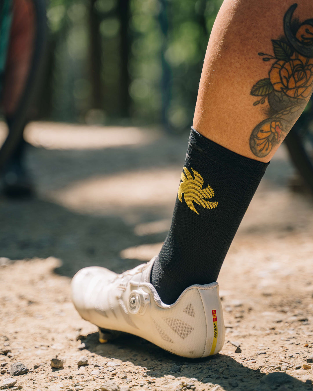 El Sol Socks with vibrant sun design, made from eco-friendly materials for ultimate comfort and performance. Perfect for running, cycling, and active lifestyles