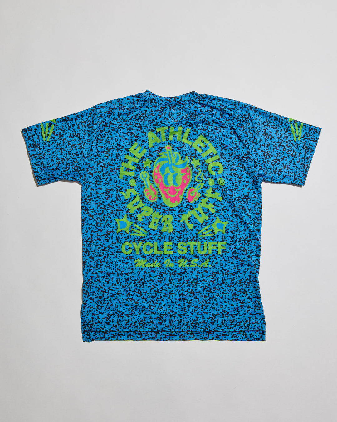 Performance Tech Tee for Running, MTB, Gravel, or Road cycling. Made in the USA by Endo Customs. This lightweight breathable shirt is perfect for when the temperature rises. This is a short sleeve tech tee with the baddest strawberry to ever exist on the back. Black speckles over a blue color give it a 90's retro look.