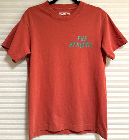 We are obsessed with this shirt. The mineral red is the perfect background for the I LIKE BIKE graphic. Let everyone know you LIKE BIKES without saying a word.

Fancy pics in the way. We just could not wait to put the shirt on the site.
Mineral red shirt with the text "I LIKE BIKE" and an image of the bike.