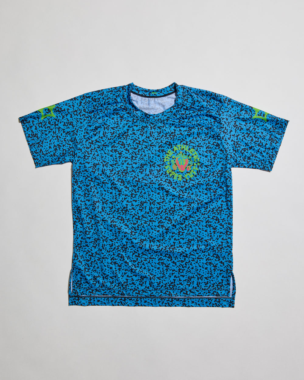 Performance Tech Tee for Running, MTB, Gravel, or Road cycling. Made in the USA by Endo Customs. This lightweight breathable shirt is perfect for when the temperature rises. This is a short sleeve tech tee with the baddest strawberry to ever exist on the back. Black speckles over a blue color give it a 90's retro look.