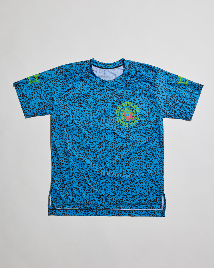 Performance Tech Tee for Running, MTB, Gravel, or Road cycling. Made in the USA by Endo Customs. This lightweight breathable shirt is perfect for when the temperature rises. This is a short sleeve tech tee with the baddest strawberry to ever exist on the back. Black speckles over a blue color give it a 90's retro look.