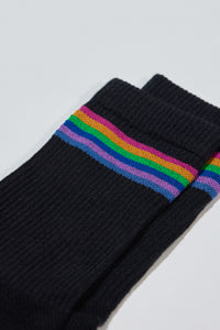 Black cushioned sock with with rainbow color band. Ribbed 5 inch cuff. Perfect for hiking, walking, or every day activities.
