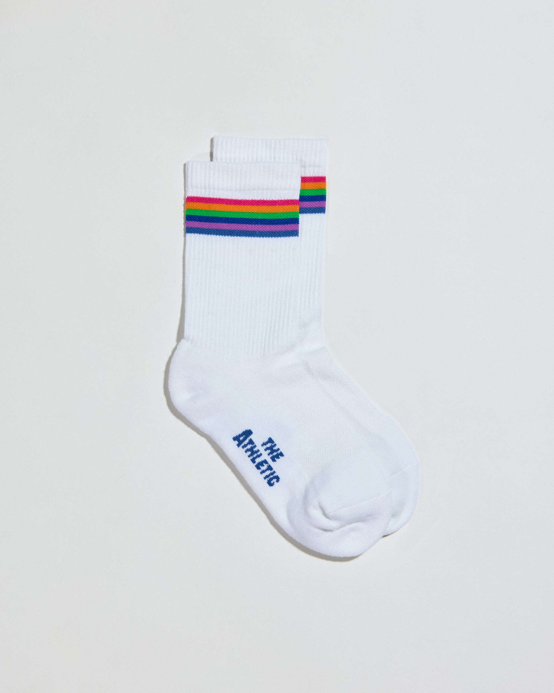 White cushioned sock with with rainbow color band. Ribbed 5 inch cuff. Perfect for hiking, walking, or every day activities.