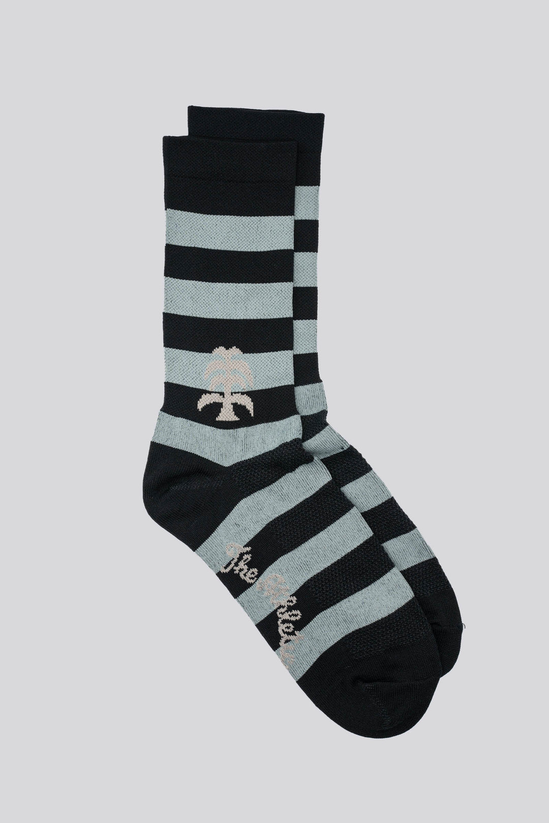 black and grey striped socks with a palm on either side of the sock