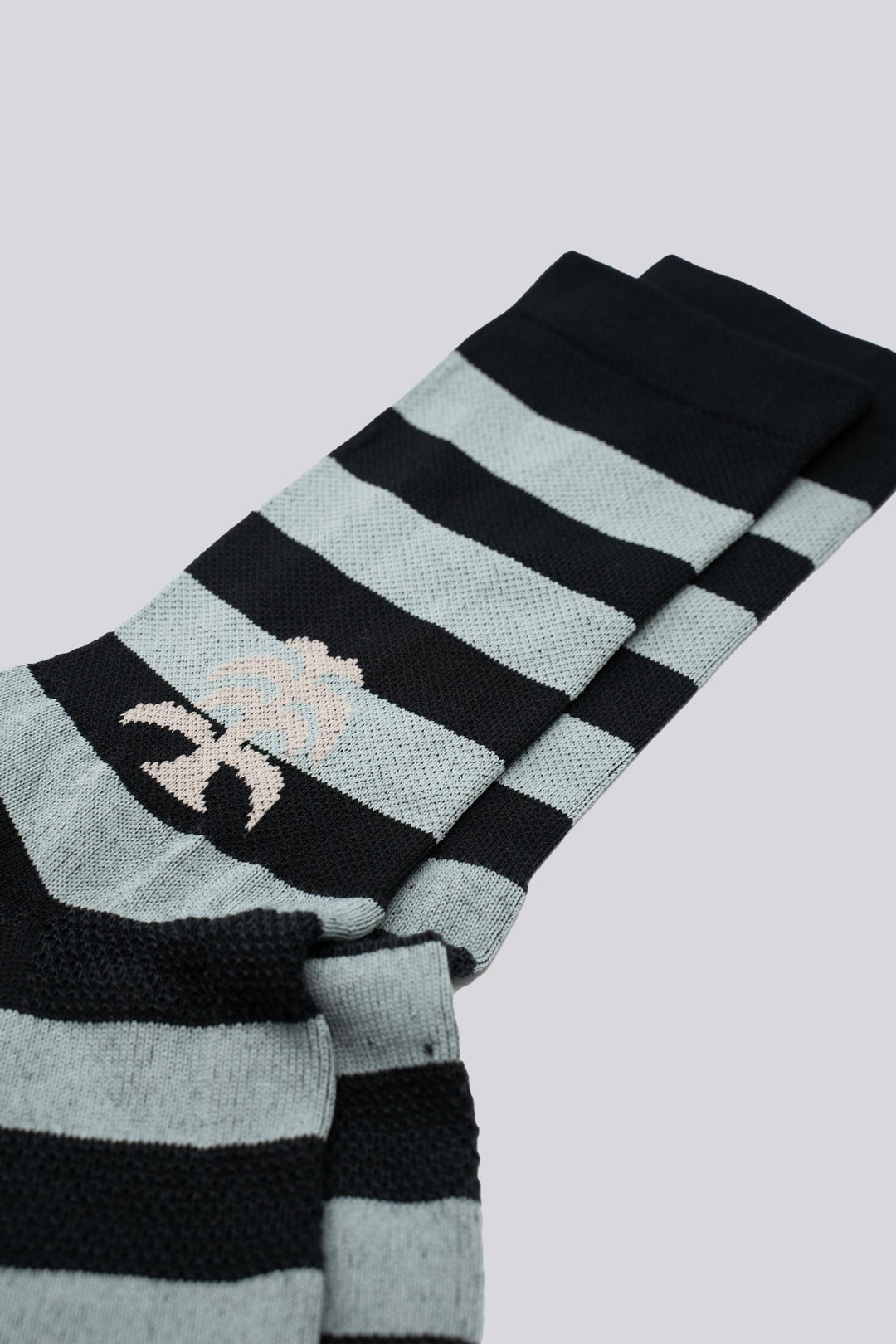 The New Favorite Striped Socks feature bold stripes in three unique designs—skull, flower, and death palm—offering a stylish update to classic patterns. Crafted for comfort and durability, these socks are perfect for running, cycling, and active lifestyles. Made with eco-friendly materials, they combine performance with sustainability