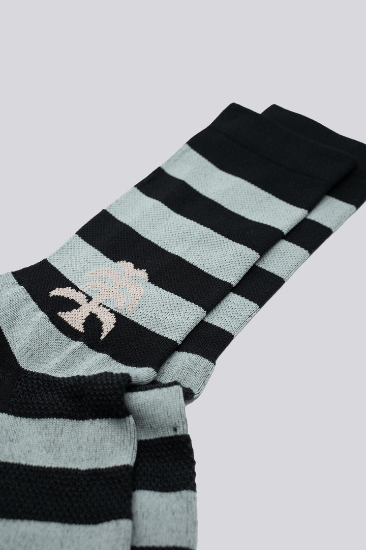 black and grey striped socks with a palm on either side of the sock