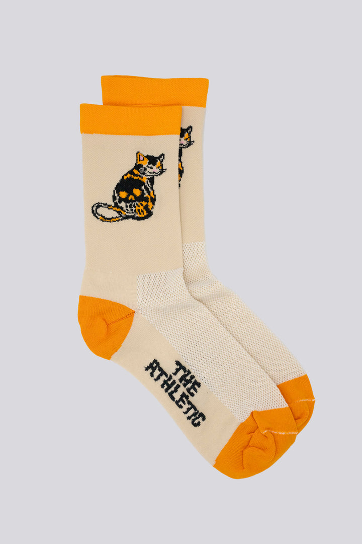 The Skull Kitty Socks, designed by artist Jake Tong, feature a playful calico cat skull design. These limited edition socks are perfect for cycling, running, and cross-training. Made in the USA with love, they combine style and performancePerfect sock for running, hiking or cycling, or the gym. Made in the USA from recycled fibers.