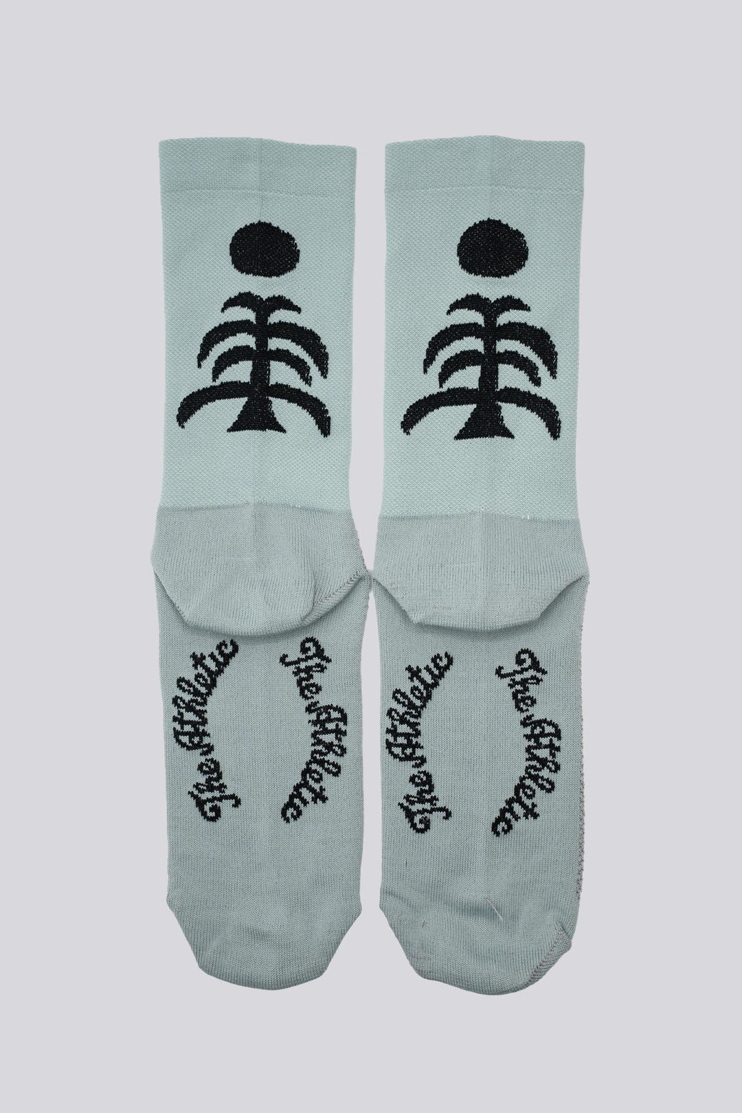 Death Palm Socks featuring a bold palm tree design, crafted for ultimate comfort and performance. Made from sustainable materials, perfect for running, cycling, and active athletes seeking style and eco-consciousness in their gear.