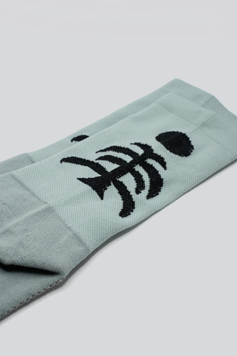 Death Palm Socks featuring a bold palm tree design, crafted for ultimate comfort and performance. Made from sustainable materials, perfect for running, cycling, and active athletes seeking style and eco-consciousness in their gear.