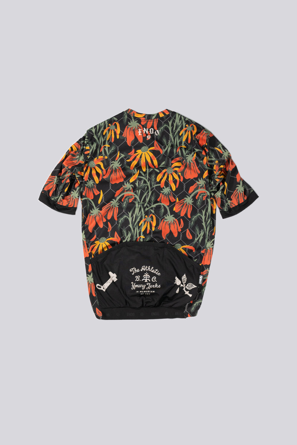 The Men's Flowers Jersey is a cycling jersey designed for both gravel and road cycling. Crafted in California from Italian fabrics by Endo Customs, it features a vibrant floral design by Young Jerks. The jersey is tailored for a snug fit, constructed with lightweight technical Italian fabrics, and includes an embossed rear elastic for added comfort. It also features a full-length reverse YKK zipper for easy ventilation