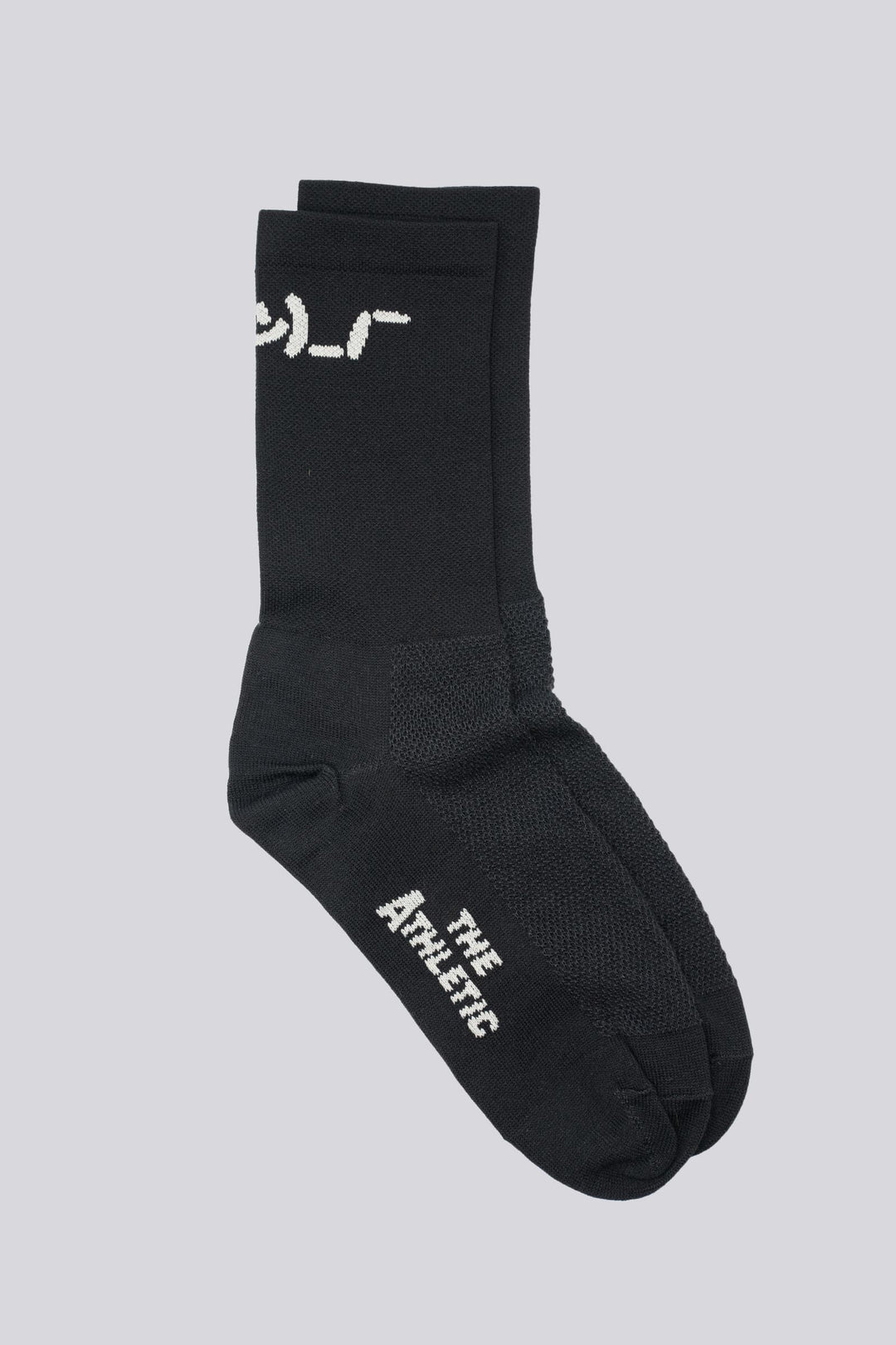 The Shruggie Socks are designed to add a touch of humor to your athletic wear. Crafted from a recycled synthetic fabric blend, these socks offer maximum performance for cycling, running, and cross-training. They feature a medium compression cuff and are suitable for all seasons