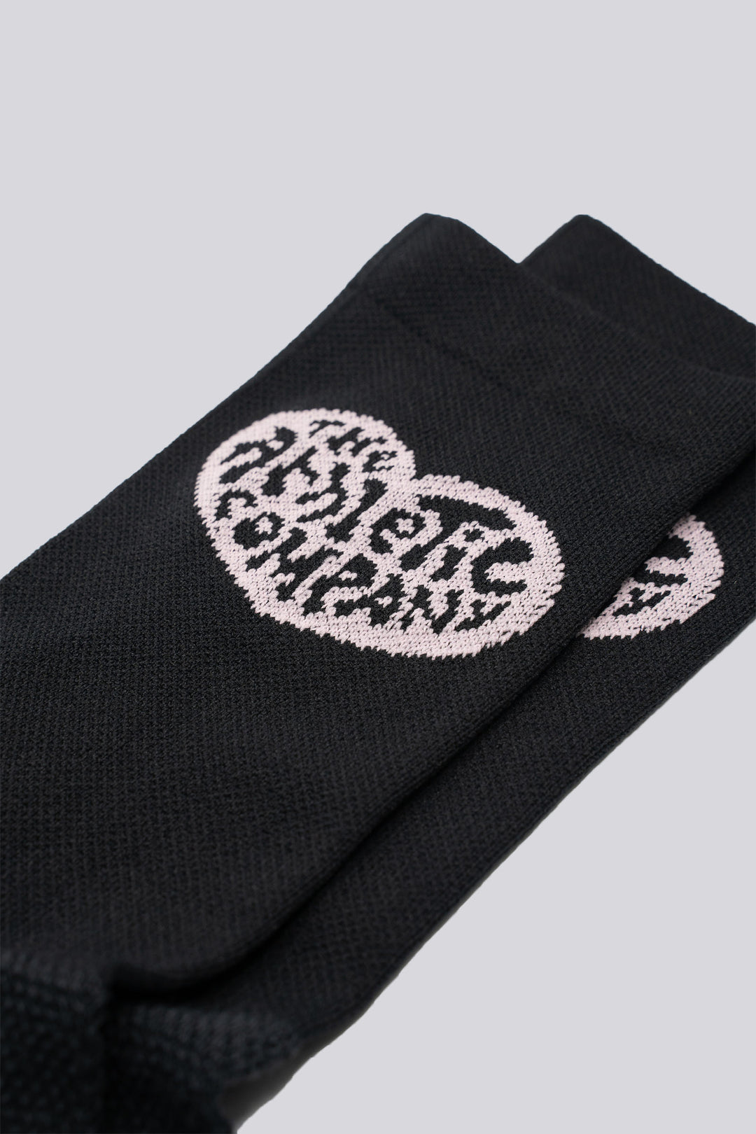 The Athletic Heart Socks are pink socks featuring a heart design on either side, specially designed for members of The Athletic Community. Perfect for cycling, running, and cross-training, these socks combine style and performance. Please note that this item is on final sale and is not eligible for returns or exchanges