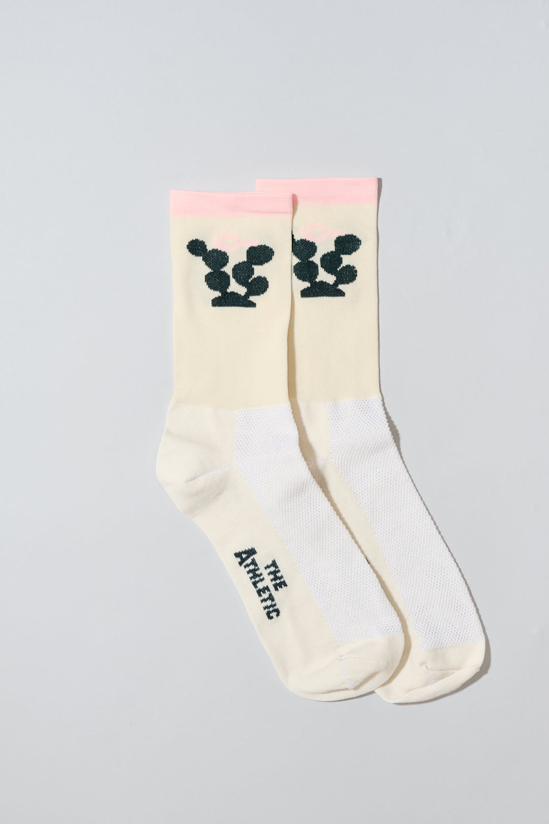 The Happy Cactus Socks, designed by artist Will Bryant, feature a playful cactus and smiley face design. Made in the USA with love, these socks are perfect for adding a touch of fun to your athletic wear. Ideal for cycling, running, and casual wear, they combine style and performance