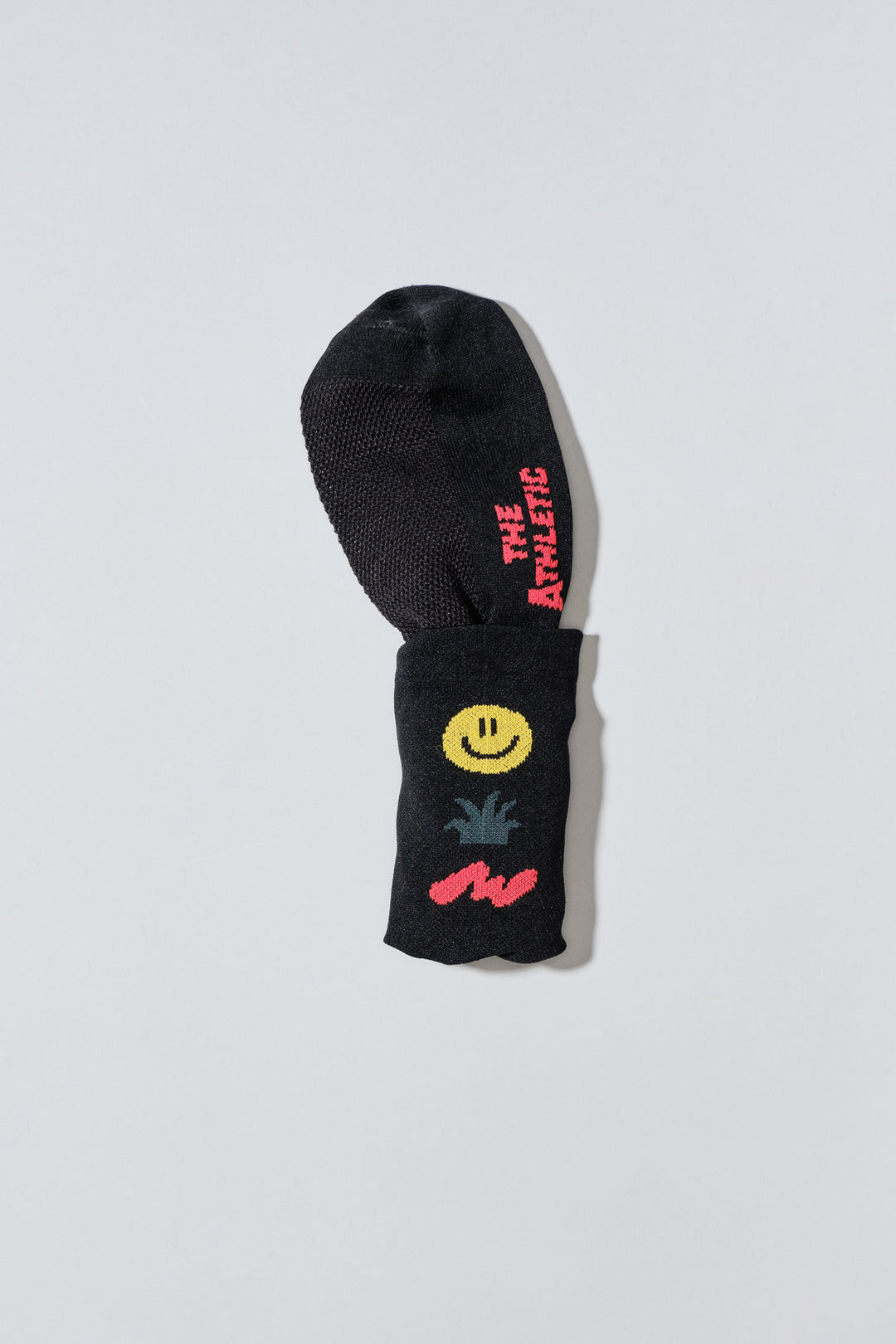 The Happy Trio Socks feature a playful design with a smiley face, cactus, and squiggle, available in off-white and black color options. Ideal for cycling, running, and cross-training, these socks combine style and performance. Made in the USA with love, they offer both durability and comfort