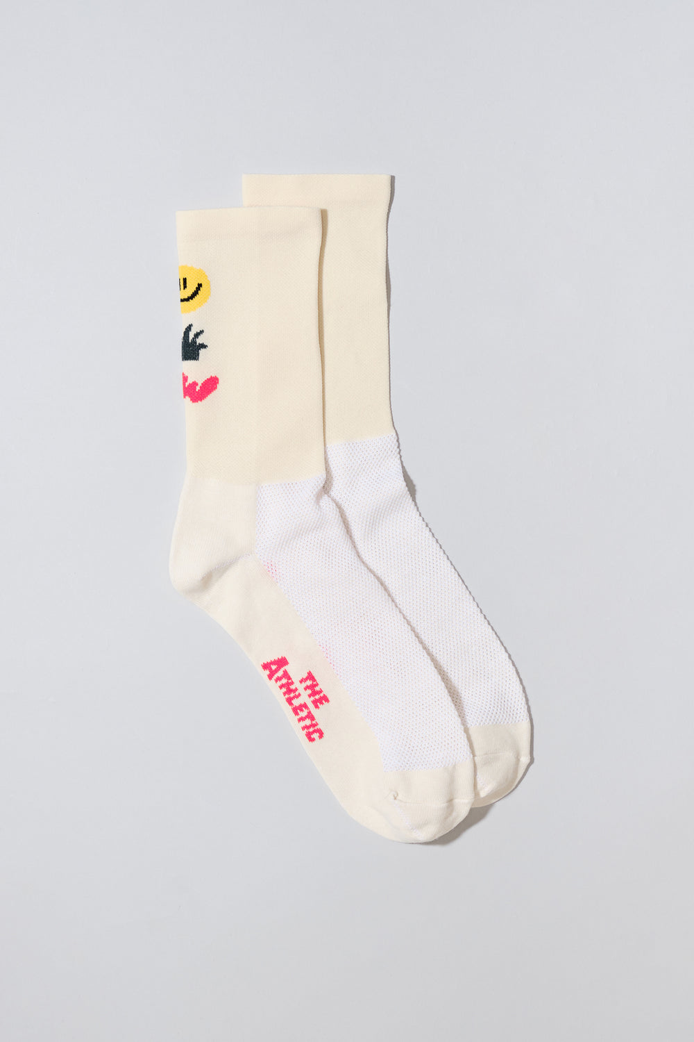 off white socks with a smiley face, cactus and squiggle