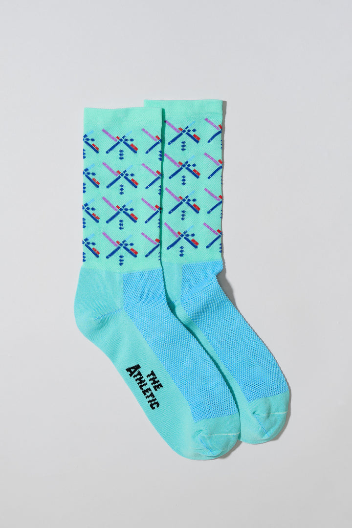 The Athletic PDX Airport Carpet Socks are inspired by the iconic Portland Airport carpet design, featuring a 7" cuff for a comfortable fit. Made in the USA with recycled fibers, these socks are perfect for running, cycling, or the gym. Celebrate Portland's unique style with these eco-friendly, performance-oriented socks