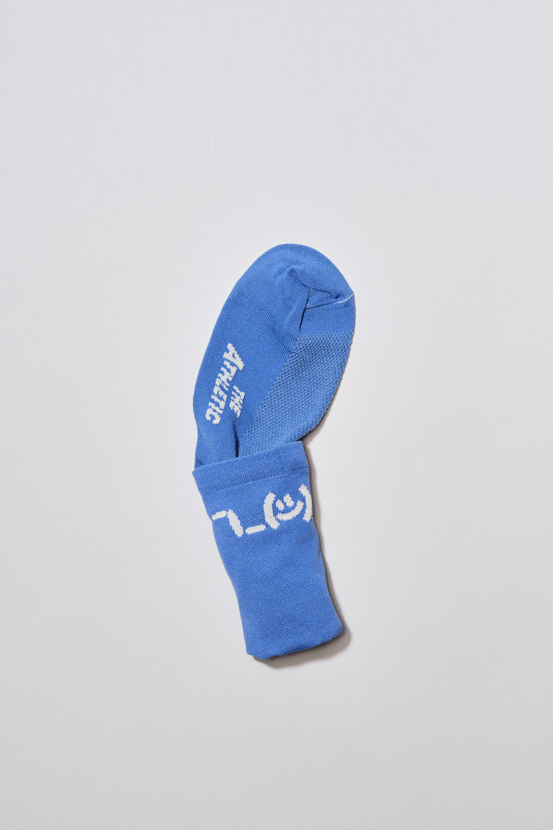 The Shruggie Socks are designed to add a touch of humor to your athletic wear. Crafted from a recycled synthetic fabric blend, these socks offer maximum performance for cycling, running, and cross-training. They feature a medium compression cuff and are suitable for all seasons