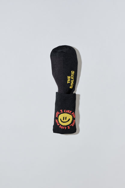 Smiley face socks with "Sure, I like fun" caption. Socks are black.